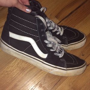 Black and white high top vans